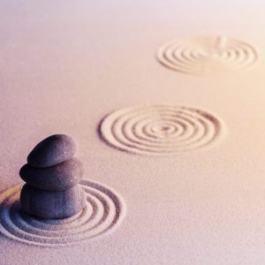 Meditation zen garden with stones on sand, toned picture